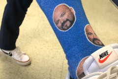 man\'s face on blue socks
