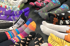 feet in a circle wearing wild socks