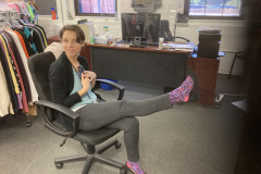woman, smiling, showing cheetah print socks